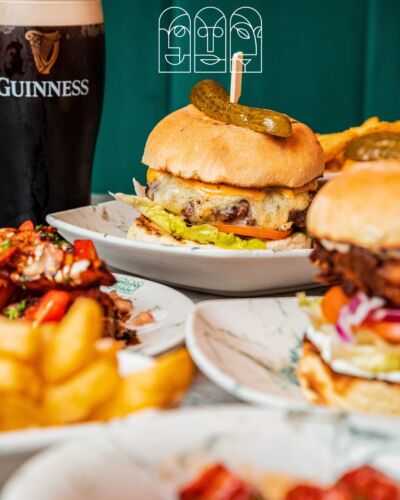 Burgers and fries with a pint of Guinness